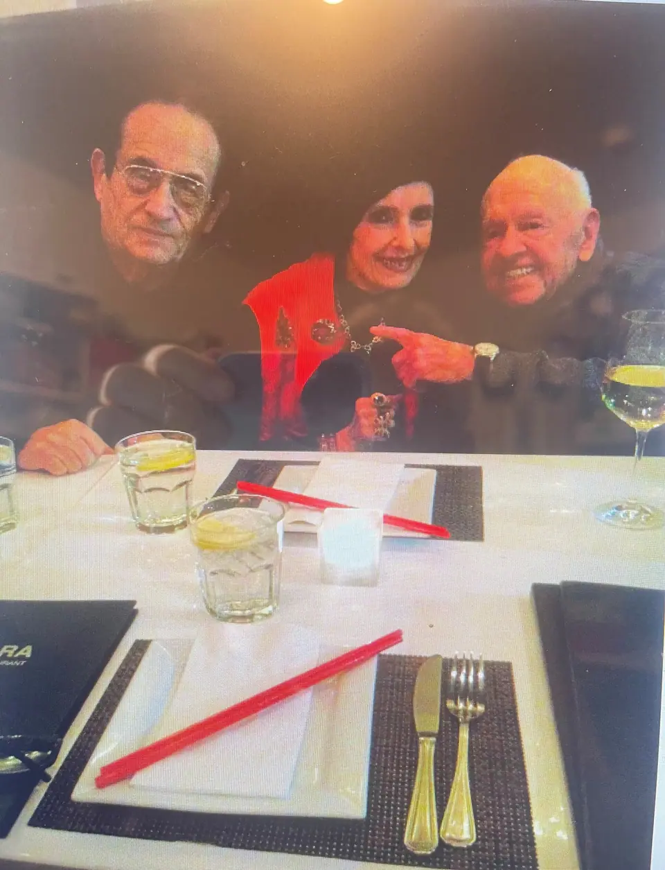 Nate Waxman, Margaret O'Brien and Mickey Rooney seated together at a restaurant table